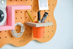 Coin créatif avec pegboard Art Studio Aire orange pastel au mur